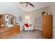 Cozy sitting area with ample room, a white chair, and decorative wood furniture at 2221 W Calle De Las Estrella Way, Phoenix, AZ 85085