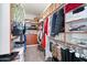 Functional walk-in closet with shelves and hanging racks for plenty of storage at 2221 W Calle De Las Estrella Way, Phoenix, AZ 85085