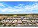 Overhead view of a residential area featuring well-maintained homes, greenery, and a serene atmosphere at 22476 E Indiana Ave, Queen Creek, AZ 85142