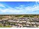 Scenic aerial shot of a residential community with manicured lawns and easy access to highways at 22476 E Indiana Ave, Queen Creek, AZ 85142