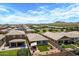 An aerial view of a well-maintained neighborhood with cozy homes, manicured lawns, and beautiful landscaping at 22476 E Indiana Ave, Queen Creek, AZ 85142