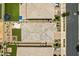 An aerial view of a home with a manicured lawn, patio furniture, and a trampoline in the backyard at 22476 E Indiana Ave, Queen Creek, AZ 85142