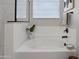 Modern bathtub with stylish fixtures and decorative accents, perfect for relaxation at 22476 E Indiana Ave, Queen Creek, AZ 85142