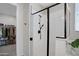 Glass-enclosed shower with sleek fixtures and ample natural light, conveniently located near a walk-in closet at 22476 E Indiana Ave, Queen Creek, AZ 85142