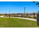 Inviting community pool area with shaded seating and lush landscaping for a resort-like experience at 22476 E Indiana Ave, Queen Creek, AZ 85142