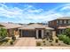 Charming single-Gathering home boasting a well-manicured lawn, paved driveway, and a two-car garage at 22476 E Indiana Ave, Queen Creek, AZ 85142