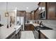 Kitchen with stainless steel appliances, large farmhouse sink and modern finishes at 22476 E Indiana Ave, Queen Creek, AZ 85142