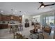 Open concept kitchen and living area with decorative seating and stainless appliances at 22476 E Indiana Ave, Queen Creek, AZ 85142