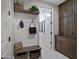 Welcoming mudroom features a bench, storage, and built-in shelving, blending functionality with stylish design at 22476 E Indiana Ave, Queen Creek, AZ 85142