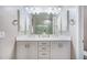 Bathroom boasts a double vanity with plentiful lighting and counter space at 2324 E Saguaro Park Ln, Phoenix, AZ 85024