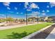 Community area featuring a bocce ball court, seating, barbecue, and covered pavilion at 2324 E Saguaro Park Ln, Phoenix, AZ 85024