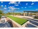 Community area featuring a bocce ball court and covered picnic tables at 2324 E Saguaro Park Ln, Phoenix, AZ 85024