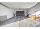 Spacious garage features custom storage cabinets and an epoxy floor at 2324 E Saguaro Park Ln, Phoenix, AZ 85024