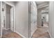 Well-lit hallway showcasing the home's layout and design at 2324 E Saguaro Park Ln, Phoenix, AZ 85024