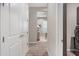Bright hallway with doors leading to other rooms in the house at 2324 E Saguaro Park Ln, Phoenix, AZ 85024