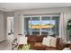 Comfortable living area with views of the pool and patio, enhanced by a sliding glass door at 2324 E Saguaro Park Ln, Phoenix, AZ 85024