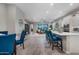Spacious living room and kitchen with hardwood floors and neutral paint at 2324 E Saguaro Park Ln, Phoenix, AZ 85024