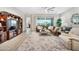 Spacious living room with a large tv, cozy seating, and access to a patio at 2324 E Saguaro Park Ln, Phoenix, AZ 85024