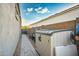 Paver side yard with outdoor storage unit and space, perfect for storing tools and equipment, with easy access at 2324 E Saguaro Park Ln, Phoenix, AZ 85024