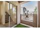 Balcony with artificial grass and a slider to the living room overlooking the parking lot at 2401 E Rio Salado Pkwy # 1048, Tempe, AZ 85288