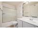 Bathroom features a tub/shower combination with glass doors, vanity, toilet, and neutral paint at 2401 E Rio Salado Pkwy # 1048, Tempe, AZ 85288