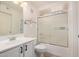 Bright bathroom featuring a vanity, toilet, and shower with glass doors at 2401 E Rio Salado Pkwy # 1048, Tempe, AZ 85288