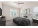 Relaxing bedroom featuring plantation shutters, neutral colors and soft carpeting for a comfortable ambiance at 2401 E Rio Salado Pkwy # 1048, Tempe, AZ 85288