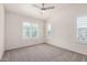 Bedroom features a ceiling fan, carpeted floor, neutral paint, and shuttered windows at 2401 E Rio Salado Pkwy # 1048, Tempe, AZ 85288
