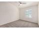 Bedroom features a ceiling fan, carpeted floor, neutral paint, and a shuttered window at 2401 E Rio Salado Pkwy # 1048, Tempe, AZ 85288