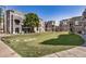 Community space with mature trees, manicured landscaping, and well-maintained townhomes at 2401 E Rio Salado Pkwy # 1048, Tempe, AZ 85288