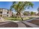 Community space with mature trees, well-maintained landscaping, and sidewalks at 2401 E Rio Salado Pkwy # 1048, Tempe, AZ 85288