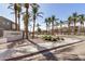 Community entrance with lush landscaping, mature palm trees, and well-maintained signage at 2401 E Rio Salado Pkwy # 1048, Tempe, AZ 85288