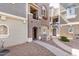 Stylish townhome exterior with walkway, balcony, and inviting entrance at 2401 E Rio Salado Pkwy # 1048, Tempe, AZ 85288