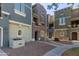 View of colorful townhome facades with landscaped grounds, offering a glimpse of community charm at 2401 E Rio Salado Pkwy # 1048, Tempe, AZ 85288