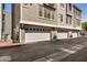 The community has multiple garages with unit number labels and parking in front at 2401 E Rio Salado Pkwy # 1048, Tempe, AZ 85288