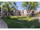 View of the community grounds with green space, trees and townhome buildings in the background at 2401 E Rio Salado Pkwy # 1048, Tempe, AZ 85288