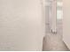 Hallway with carpet and white walls leading to a bedroom with windows at 2401 E Rio Salado Pkwy # 1048, Tempe, AZ 85288
