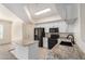 Bright kitchen features granite countertops, black appliances, an island, and white cabinetry at 2401 E Rio Salado Pkwy # 1048, Tempe, AZ 85288