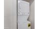 Close-up of stacked washer and dryer, highlighting laundry appliances and space-saving design at 2401 E Rio Salado Pkwy # 1048, Tempe, AZ 85288