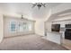 Open living area with carpet, kitchen, modern lighting, and windows for natural light at 2401 E Rio Salado Pkwy # 1048, Tempe, AZ 85288