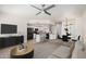 Bright living room features a modern kitchen with sleek appliances and an adjacent dining area at 2401 E Rio Salado Pkwy # 1048, Tempe, AZ 85288