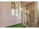 Patio with artificial grass, white wall, and a slider to the living room at 2401 E Rio Salado Pkwy # 1048, Tempe, AZ 85288