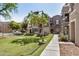 Townhomes with mature trees, sidewalks, and well-maintained landscaping at 2401 E Rio Salado Pkwy # 1048, Tempe, AZ 85288