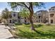 Townhomes with mature trees, well-maintained landscaping, and sidewalks at 2401 E Rio Salado Pkwy # 1048, Tempe, AZ 85288