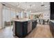 Spacious kitchen with a large island, stainless steel appliances, and an open layout with great lighting at 2412 W Gloria Ln, Phoenix, AZ 85085