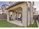 Covered patio with outdoor seating area and access to the backyard, perfect for outdoor entertaining at 2412 W Gloria Ln, Phoenix, AZ 85085
