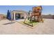 Expansive backyard featuring a covered patio and playground at 29481 W Mitchell Ave, Buckeye, AZ 85396
