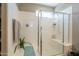 Bathroom with glass enclosed walk-in shower, with a seating bench at 29481 W Mitchell Ave, Buckeye, AZ 85396