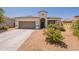 Beautiful single-story home showcasing desert landscaping, a two-car garage, and a charming entry at 29481 W Mitchell Ave, Buckeye, AZ 85396