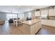 Open concept kitchen and dining area with granite countertops and seamless flow to living room at 29481 W Mitchell Ave, Buckeye, AZ 85396